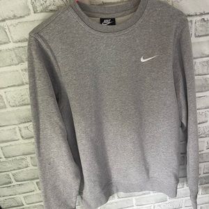 This is a grey Nike crewneck and has never been worn before